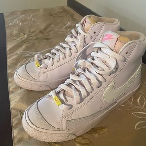 Nike high top tennis shoes.